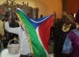 Pst Alberto and Mama Magdalena holding up the flag of Equitorial Guinea